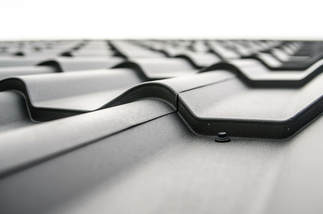A close-up of black tiled roof